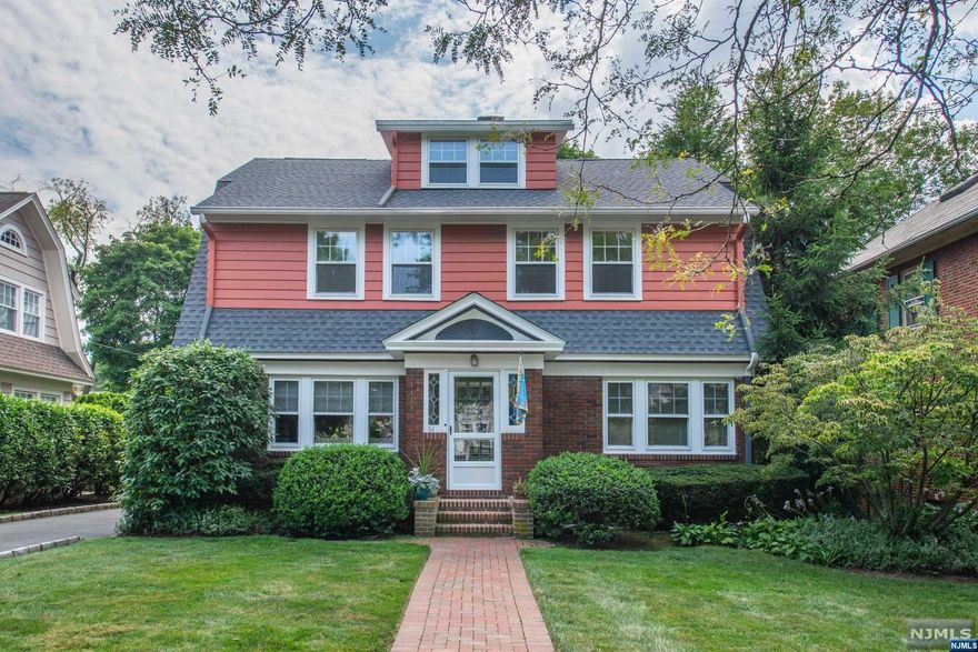 4-BR, 1.2-bth Dutch Colonial on quiet street, w 2-car detached garage, private backyard, near shops/restaurants, NYC transport. Walkway w mature plantings. Foyer w leaded glass windows. LR w palladium arch, crown moldings, oak fls w ribbon inlay, closet & WB FP. Sunrm w ceiling fan & builtins. Formal DR w ribbon oak fls. French doors open to screened porch w bluestone fl & views of patio, Belgian block driveway, backyard. EIK w peninsula, custom cabinets, ceiling fan, butler pantry, powder rm & back stairs to 2nd flr & basement. 2nd fl w 4 BRs, 2 w ceiling fans. Linen closet, full bth w subway tiles, vanity, tub/shower & laundry chute! 1 BR used as home office w access to 3rd fl fam rm w CAC, recessed lights & storage. Full unfin basement w laundry, 2nd fridge, utility rm, storage & powder rm. Backyard w patio, lawn, motion sensor lights. Updated electric inc backup generator & hookup. New roof. Near NYC Train, Farmer Mkt, Walnut & Grove St shops/restaurants, downtown Montclair.