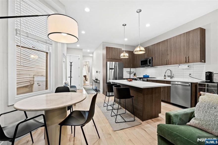 A standout offering at 289 Webster, this fully reimagined duplex sets a new standard for modern style and sophistication. Thoughtfully renovated from top to bottom, the home blends modern design with elevated finishes. Wide-plank maple flooring runs throughout, while soaring ceilings, oversized doors, and expansive Pella windows enhance the sense of space and bring in natural light, creating a warm yet sophisticated atmosphere. The kitchen is both sleek and functional, featuring imported Italian cabinetry, quartz countertops, and a premium Bosch 800 Series appliance package, complete with a built-in wine refrigeratorâ€”ideal for everyday living and entertaining alike. Bathrooms are finished with a refined, contemporary edge, showcasing Hansgrohe fixtures, floating vanities, and distinctive design elements such as textured accent walls that add depth and character. Smart home featuresâ€”including a Nest thermostat, video intercom system, and keyless Schlage entryâ€”add convenience and security. Perfectly situated just moments from the Congress Street Light Rail and the expansive Washington Park, this unit blends spacious comfort and convenience.