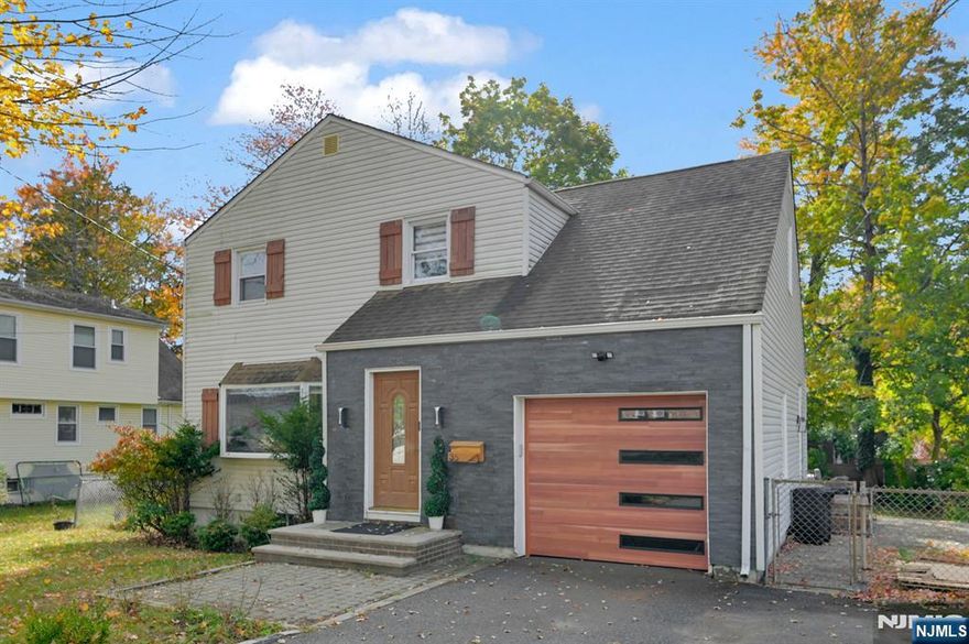 Beautifully Designed 3-Bedroom, 3.5-Bath Home in the Heart of Livingston! Welcome to 35 Grand Terr, a stunning 3-level home offering thoughtfully designed living space on a flat lot. The inviting open-concept main floor features a bright living room with an elegant wood fireplace, spacious dining area, and a modern kitchen with a center island perfect for entertaining and family gatherings. Enjoy direct access to a large patio, ideal for outdoor dining, relaxation, and year-round entertaining. A powder room and convenient garage access complete this level.Upstairs, the primary suite provides a peaceful retreat with generous closet space. Two additional bedrooms, a full hall bath, and a laundry area add functionality and comfort to this well-designed floor. The finished lower level offers exceptional versatility with a spacious recreation room, wet bar, full bath, and utility area ideal for a home gym, media room, or guest suite.Additional highlights include an attached garage, ample storage, and a flat, usable yard perfect for play or entertaining. Conveniently located near top-rated Livingston schools, NYC transportation, shopping, and parks, this 3-bed, 3.5-bath home blends modern living with suburban charm.