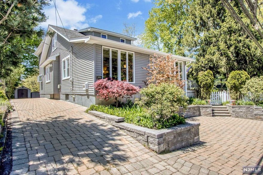 Beautifully expanded 4-BR colonial in Norwood. Welcoming foyer and sitting area with large windows for natural light. Spacious living room open to dining room-great for entertaining. Beautiful gourmet kitchen featuring custom cabinets, large center island and stainless appliances. Spacious family room off of kitchen with one-of-a-kind custom pantry. Generous-sized bedroom and updated full bath completes the first level. Second level offers three large bedrooms and an updated full bath. Fully finished lower level including den/recreation room and spacious laundry room with peninsula and cabinets for storage. Breathtaking property offers garden oasis with paver patio and driveway.