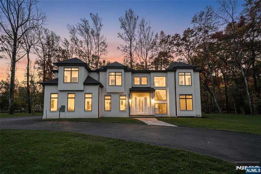 Unveil River Valeâ€™s most coveted estate, where modern design and natural tranquility come together. Set on 2.7 private acres, this 4,400 sq ft new construction smart home plus a spacious bonus basement, showcases exceptional craftsmanship and future potential, with 5 expansive bedrooms and 4.5 custom bathrooms, including a primary bath with a luxurious wet room and soaking tub. he chefâ€™s kitchen features GE Monogram appliances and custom cabinetry, while wide-plank white oak flooring flows throughout. Black-framed windows highlight the contemporary aesthetic, and the hard-coat cement exterior ensures lasting durability. With 10-ft ceilings on the first floor and 9-ft ceilings on both the second level and lower level, every detail has been designed with comfort and style in mind. The property also includes a 3-car attached garage, and the high-efficiency heating and cooling systems complete the home. A distinctive new construction opportunity in River Vale.