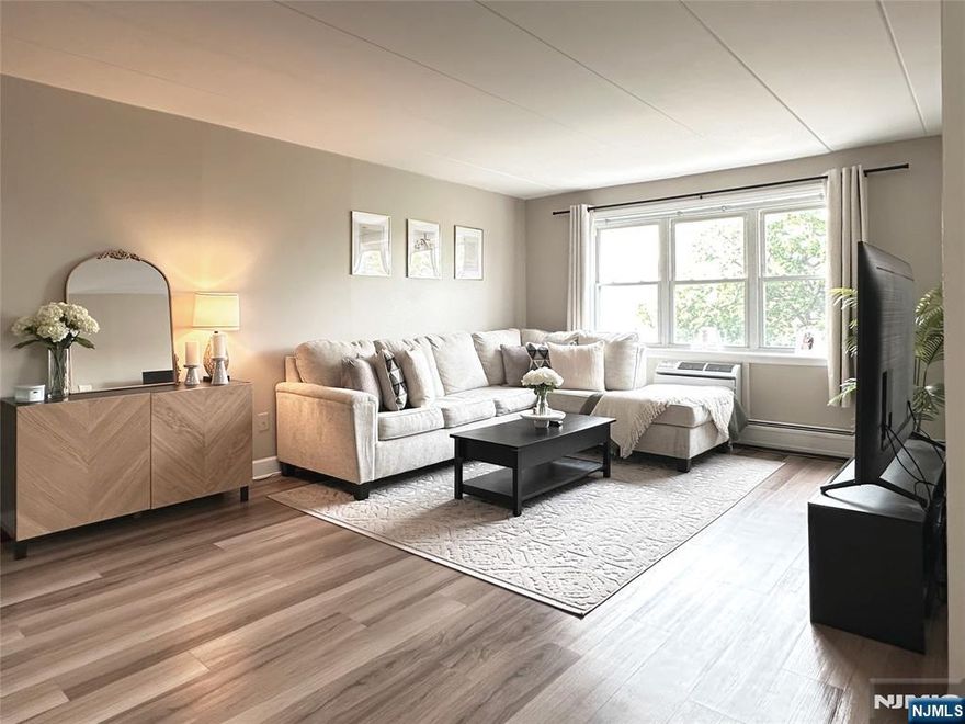 Bathed in natural light, this sun-drenched corner residence in Hackensacks coveted Fairmount section offers 818 sq. ft. of thoughtfully renovated living space. The expansive living room flows seamlessly into the dining area, creating an open and inviting layout. A beautifully updated kitchen and modern bath provide the contemporary touches todays buyers seek. With the NYC bus stop just steps away and the train station nearby, commuting is effortless. Enjoy the convenience of nearby shopping and dining, completing a lifestyle of comfort, style, and accessibility. HOA includes: water, hot water, heating, gas, one outdoor assigned parking spot #11