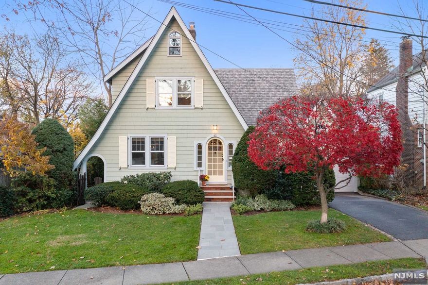 A Verona charmer. This home is chic, comfy, and characteristically modern! Nestled in the Afterglow section of Verona. With a barrel-vaulted living room ceiling, a wood-burning fireplace, hardwood floors, and original architectural details including an oversized round window in the dining room, a custom wrought iron railing on the balcony, and an exquisite stained glass window. A convenient first-floor bedroom and full bathroom. The sunlit kitchen is a cooks' delight with direct access to the rear deck for enjoyable alfresco dining. The main bathroom on the second floor features a jetted tub & standing shower, all crafted of Carrara marble and a custom vanity cabinet. A fully finished basement with a walk-out entrance to the driveway offers something for everyone from a rec room and second office to a laundry center and bonus storage areas. The two-car garage with a full loft is terrific for storage. Central Air Condition and New Heating Furnace. "Home Sweet Home"