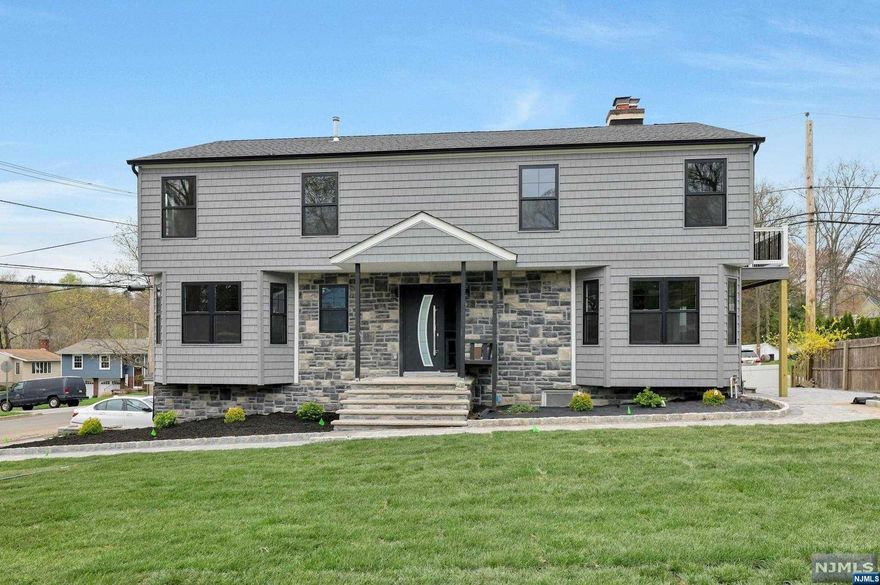 Beautifully, totally renovated 5-bedroom 3 full bath colonial. First floor features: Living room with fireplace, Diving room, Custom kitchen with quartz center island, stainless steel appliances, glass sliding door to a patio, bedroom, full bath. Second floor Features: Primary bedroom / primary bath, beautiful fireplace,3more bedrooms and another full bath. Basement is finished with a 2-car attached garage. Professionally landscaped yard with paver. Close to major highways.