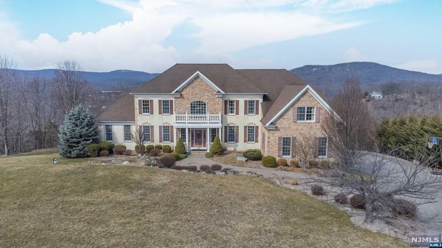 The gorgeous home boasts 5400 square feet of living space on almost 1 acre of property with the MILLION DOLLAR VIEW you've been waiting for! Inside you'll be greeted by a sweeping 2-story entryway with a grand double staircase. The gourmet kitchen is a chef's dream and features top-of-the-line appliances, extensive counter space, and beautiful cabinetry. The spacious kitchen flows seamlessly into the dining and great rooms, making it the perfect space for entertaining. The master suite is a true oasis, with luxurious en-suite bathroom, walk-in closet, sitting room, and private bonus room. the 3 remaining bedrooms each has its own full bath as well. Located on a quiet cul-de-sac, this home offers the perfect balance of privacy and luxury. Whether you're hosting a dinner party, relaxing by the fireplace, or enjoying the serenity of the backyard oasis and gorgeous view from the oversized deck, this home is the ultimate retreat. Don't miss the opportunity to make this beauty yours.