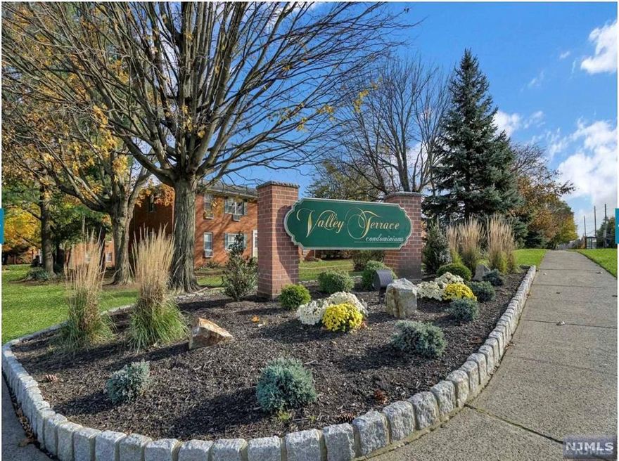 1st floor corner unit with front and back door. Unit updated in 2021 - Updates include the entire bathroom, replacing carpet with laminate wood flooring (matching the LR/DR) and windows in the bedroom, counter tops in the Kitchen and opened to the DR.