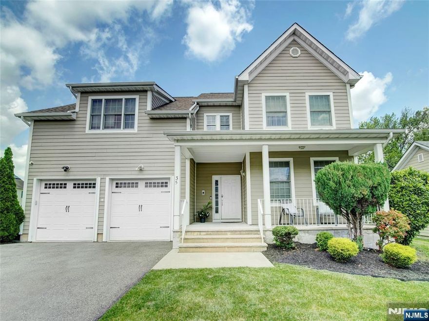 Welcome to The Woodlands at Upsala Community! This stately 4-bedroom, Colonial is approximately 3,200 sq ft and offers refined living in a serene neighborhood. The entrance foyer of the Yale model showcases soaring ceilings, natural light and vibrant hardwood floors. The formal living and dining rooms flow seamlessly into the kitchen, featuring stainless steel appliances, custom cabinetry, and generous counter space. The kitchen sliders transition to an expansive deck and a deep running backyard full of lush grass; perfect for gatherings and outdoor enjoyment. The private primary suite is thoughtfully set apart from the three other bedrooms, enhancing privacy. A full, unfinished basement provides endless potential for customization. Additional highlights include a grand family room with a wood-burning fireplace, a two-car garage, attic storage, dual-zone cooling, and more. Enjoy full sunsets from the rear deck and the city fireworks from the front porch. Streamlined access to NYC via nearby highways and public transit. This community awaits you!