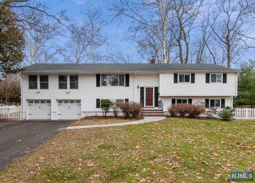 Large custom bi-level home in desirable Collins Estate neighborhood. Fresh painted 1st floor offers beautiful hardwood floors, big Master-suite w/ vaulted ceiling, his & hers WICs & full tub/shower bathroom; Eat-in kitchen w/ new tile floor, s/s appliances & new granite countertop; sliding doors off dining room leading outside to a maintenance-free deck for summer gathering & barbecue; three more bedrooms & hallway full bath (2017). Ground floor offers large family/play room, 1 bedroom, study/den, full bath & laundry room (new dryer '21). This house is excellent for one-floor-living life style, in move-in condition. 2-zone central AC, 0.4 acres of property. No flood insurance required.