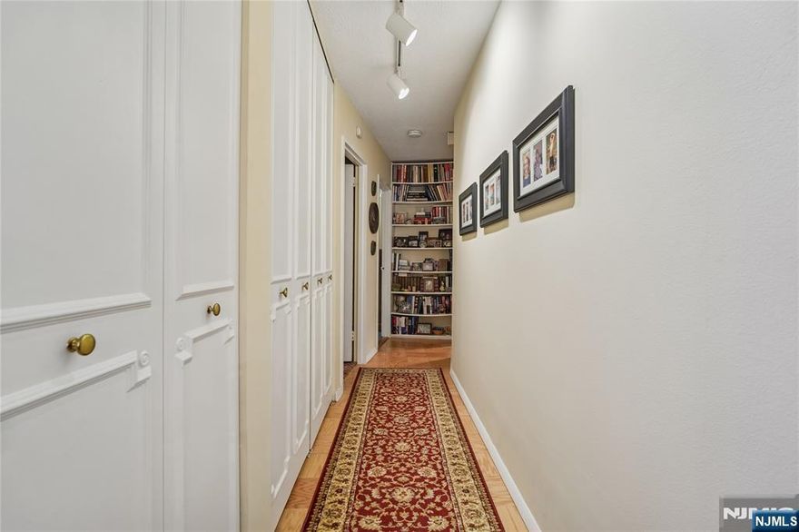 2 BR 2 BATH WARM INVITING U LINE THAT IS APPROX 1030 SQ. FT. Entry, newer eat in white kitchen, ceramic tile floor and backsplash,, appliances approx. 5 years old, parquet floors in entry, dining area, living room, hall. Double door access to large terrace. Hall full bathroom with newer marble vanity, custom brass fixtures, (lighting is included). Primary bedroom ensuite. Parking is 60.00 a month indoors, or 55.00 outdoors. Building iw wired for FIOR AND SPECTRUM--YOUR CHOICE. Board approval required. BRAND NEW State of the art gym-inc in maintenance, community rm, tennis, basksetball, pickelball. Monthly maintenanace includes: re tax, heat, hot water, central air, uniformed doorman, full time super, and gym. NJ TRANSIT BUS 158 --AT THE DOOR!