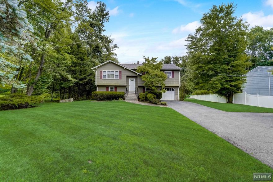 Highest and Best offers due Tuesday 3/29 by 3 PM. All seasons a pleasure in this welcoming bi-level on the edge of your private preserved woodlands & seasonal back yard paradise. No stress here just serene nature. The main level offers gleaming HW floors, open concept kitchen to DR&LR. SS appliances, custom cabinetry & granite countertops. 3 BR w/carpet over hardwoods and double closets & main bath. Ground level w/generous family room including a wood burning stove with brick surround & hearth, slate & carpet, newly expanded & updated bathroom, flex room to laundry room & 1car garage. French doors to the paver patio and walkway to private heated, in-ground pool, pool house & deck. Located near golf course, hiking, biking, hunting, fishing and more. Minutes to Lake Hopatcong and water activities. New Septic and above-ground oil tank have been recently installed.