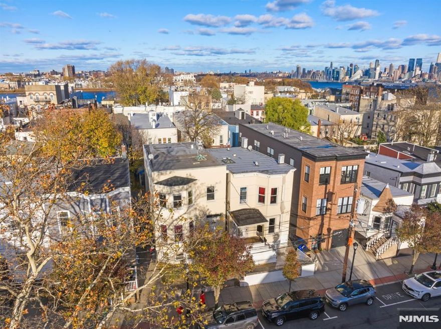 Rare opportunity to own in this unique location: The open intersection at Mountain Rd.. This South/SW facing 2 Family house has a very welcoming front porch that has partial views of mid town. A cheerful place to sit outside and enjoy the neighborhood from. Inside gets lots of sunlight and has 9.5"Ft ceiling height and hardwood floors throughout. It also has a deck in back and a 2 car garage (via a narrow driveway that will only accommodate small vehicles). This home has been renovated and has separate meters and an unfinished basement. Current total rent is approx. $4,750.