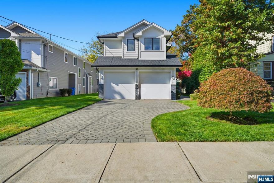 YOUNG LUXURY HOME IN DESIRABLE TENAFLY! Incredible opportunity to own a beautifully like new 7-year-old home offering over 5,000sq ft home Featuring timeless design and top-of-the-line finishesâ€”Hardie plank exterior, paver driveway and patio with gas line for BBQ, and an attached 2-car garage. Elegant double-height foyer opens to spacious living and dining areas, a bright family room, and a modern chefâ€™s kitchen with large stone island and premium Jenn-Air appliances. Upstairs offers a serene primary suite with spa-like bath, junior suite, and two additional bedrooms sharing a Jack-and-Jill bath. Lower level includes a media room, recreation area, full bath, and guest bedroom. Prime location near NYC transportation and top-rated schools!