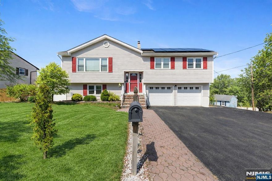 Welcome to this beautifully maintained 4-bedroom, 3 full bath Bi-Level home ideally situated on a desirable corner lot. Offering a perfect blend of space, functionality, and modern updates, this home is designed for comfortable everyday living and effortless entertaining. The main level features gleaming hardwood floors, recessed lighting, and a bright, open layout. The kitchen is highlighted by a skylight and breakfast bar, creating a warm and inviting space for casual dining. The dining area is enhanced by brand-new sliding doors that lead directly to an upper-level deckâ€”perfect for indoor-outdoor living. The primary bedroom offers a private en suite bath and two generous closets, providing both comfort and convenience. The lower level expands your living space with a spacious family room, 4th bedroom, and a full bathâ€”ideal for guests, extended living, or a home office. A walk-out door leads to a patio and fully fenced backyard, offering privacy and a great setting for relaxation or entertaining. Additional highlights include a 2-car garage, solar panel system for energy efficiency, new supplemental electric wall heater, pull-down attic for extra storage, and a storage shed. The home is serviced by city water and sewer and features an above-ground oil tank. Conveniently located close to the center of town, shopping, dining, and all major highways, this home offers the perfect combination of location, lifestyle, and value. Interior photos 04/16/2026.