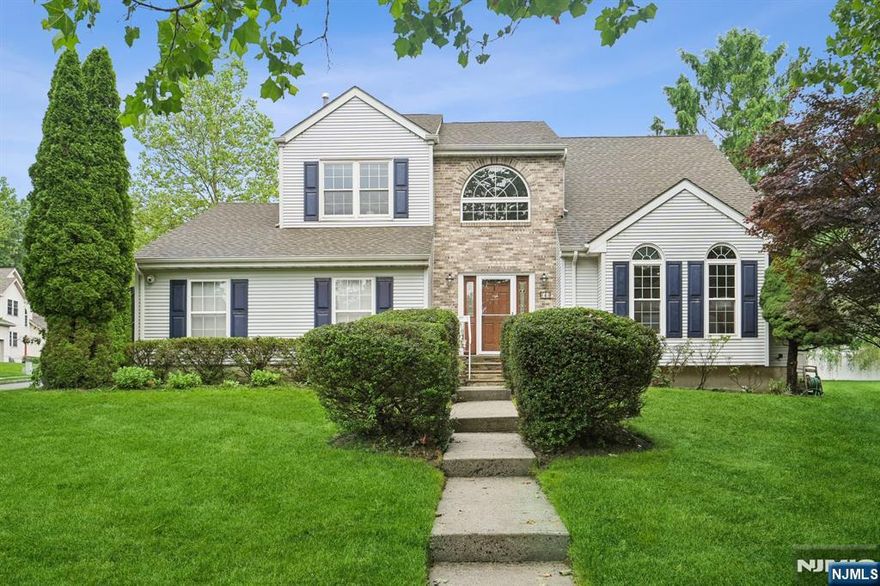 Chic, comfortable, and convenient - on a private cul-de-sac in the desirable St. Cloud neighborhood, this colonial was built in 1995 with 4 spacious bedrooms and 2.5 baths, and checks all the boxes! A two-story welcoming foyer adjoins a spacious living room with a vaulted ceiling and a formal dining room with crown mouldings and a bay window. The updated chef's eat-in kitchen with stainless appliances, granite countertops, and custom cabinets, opens to an oversized family room with a stone-faced gas fireplace and sliders to the rear yard. Convenient first-floor powder room, laundry center, and mud room! Retreat to the primary bedroom with an ensuite spa-like bath and walk-in closet on the second floor. With three more sunlit bedrooms and a hallway bath. Two-car attached garage. Paver Patio at the rear overlooking a lush, green rear yard. New Roof 2015. Newly painted interior. Welcome home!