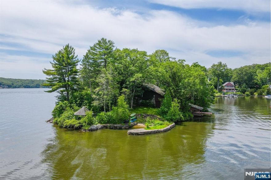 Lakefront Retreat Ready For A Visionary! This Truly Unique Opportunity Is A Perfectly Positioned Lot On Desirable Rocky Point Peninsula! Offering Unmatched Serenity And Sweeping 6 Mile Views North Toward Greenwood Lake, NY! With An Impressive 355ft Of Pristine Lake Frontage Wrapping The Lot, This Property Delivers The Ultimate Lakeside Living Experience! A Network Of Scenic Paths Leads You To The Water's Edge, Where You'll Discover Your Very Own Mini Beach Spot Perfect For Launching Kayaks, Or Enjoying Peaceful Afternoons By The Water! The Rolling, Tiered Lot Invites You To Design The Ultimate Outdoor Escape! Imagine Sun-Drenched Patios Cascading Down To The Lake, Perfect For Entertaining Or Simply Unwinding In Total Privacy! Presently The Current Home Offers 3 Spacious Bedrooms And 3.5 Baths! The Current Floor Plan Includes 3 Levels Through Spiraling Stairways, An Oversized Two-Car Garage, And A Boat House Layout Ready For Your Vision! Whether You're Looking To Transform This Residence Into Your Full-Time Dream Home Or Create A Stunning Weekend Retreat, The Setting Is Second To None! Privacy Meets Luxury With Direct Lake Access For Boating, Fishing, Or Peaceful Mornings Spent Watching The Sunrise From Your Secluded Shoreline! Opportunities Like This Are Incredibly Rare! Own A One-Of-A-Kind Slice Of Lakeside Paradise And Embrace A Lifestyle Of Adventure, Relaxation, And Natural Beauty! Schedule Your Private Tour Today And Let Your Lakefront Dream Begin!