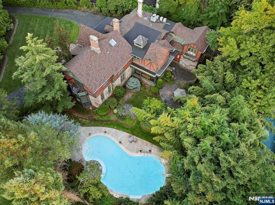 (((Watch the video!))) https://www.njproper.com/mls-20-forest Welcome to the Historic Everett-Dunn Estate. Rich in history, character & charm, this impressive residence features 18 rooms spanning over approximately 8,000 SF of the finished interior with 6 bedrooms & 6.5 baths, including 3 Suites & a guest wing, and 3 garage parking spaces. Noteworthy design by acclaimed 19th century architect, Richard Morris Hunt, and set beautifully in one of Tenafly's most prestigious East Hill addresses, the large 2/3 acre property includes a grand front yard, circular driveway, heated in-ground pool, and mature landscaping. Scenic & private with great space to entertain both inside and outside, 20 Forest Rd is minutes from Manhattan, close to worship, downtown Tenafly & it's award winning schools. Make it yours! (((The virtual tour link here features a comprehensive tour of the estate with many additional details + an interactive 3D model of the entire house + floor plans. Check it out!))