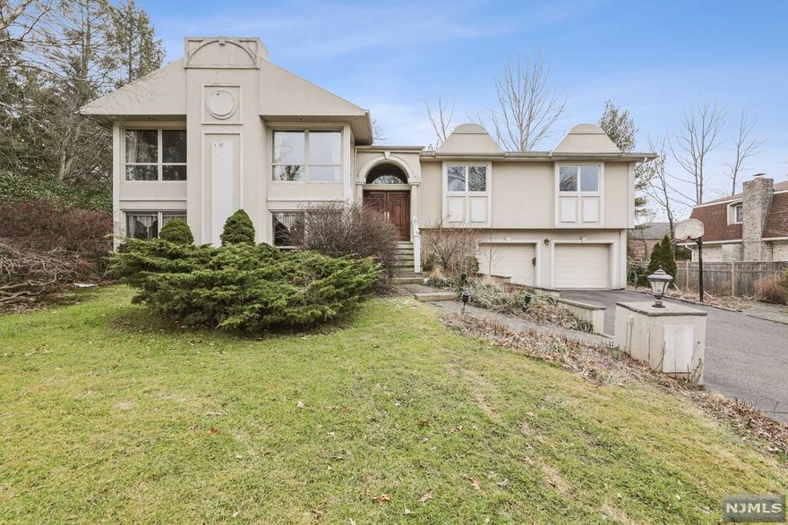 LOCATION!LOCATION!LOCATION! Excellent opportunity to live on this private cul de sac on a dead end street in the North Cliffs. Entrance foyer leads upstairs to a large living room with a fireplace,formal dining room,eat in kitchen with a skylight leading to an outdoor deck. Primary bedroom with full bath,2 additional large bedrooms,hallway bath and an office with french doors complete this level. The stairway flows graciously down to a lower level which consists of a great room with a fire place,2 bedrooms,a full bath,laundry,storage,2 car garage and exit to the backyard and pool.Pool sold "as is'. Full house generator.Renovate to make it your dream home. A must see!