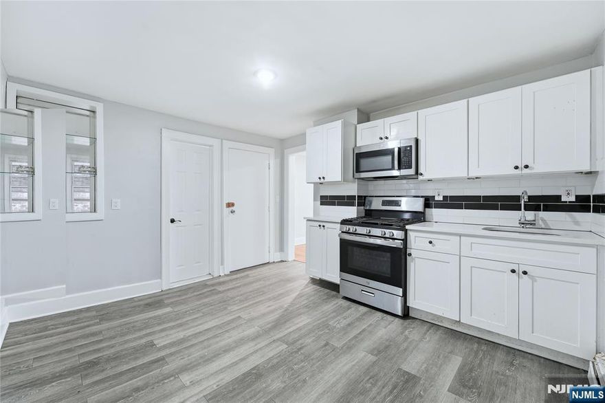 Welcome to this beautifully renovated 2-family residence, ideally located in one of Elizabeth's most desirable neighborhoods. Thoughtfully updated from top to bottom, this home offers a refined blend of modern design and functional living, making it an excellent opportunity for both owner-occupants and investors. The property features 6 spacious bedrooms and 3 full bathrooms, all finished with contemporary materials and clean, elegant details. The renovated kitchens are designed for both everyday living and entertaining, offering sleek cabinetry and practical layouts. A fully finished attic provides valuable additional living space, ideal for a private retreat, home office, or flexible bonus area. The fully renovated basement further enhances the home's versatility, perfect for recreation, extended living, or storage. Conveniently located near transportation, shopping, dining, and major highways, this turnkey property delivers both lifestyle convenience and strong income potential. A rare opportunity to own a move-in-ready two-family home in a prime Elizabeth location.