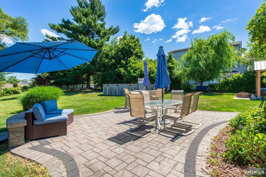 Not a Drive By! This oversized cape has a great flow with tons of room and an entertainer's yard on a massive property. Home features 3/4 bedrooms, 3 full baths, and beautiful heated sunroom on the first floor overlooking the beautiful yard. Downstairs you will find a huge family room, a bar room with a kitchenette, office, and a bonus room with a full bath. A great set up for multi-generational living. If you love spending time outdoors, there are 2 beautiful paver patios, one with a gazebo equipped with TV wiring, and let's not forget the beautiful above ground pool. The home is complete with 2 driveways, a garage, full alarm system, pre-wired for 5 security cameras, outdoor BOSE speakers w/Bluetooth and backyard is pre-wired for Wi-fi. This home has everything you need plus more, it's a must see.