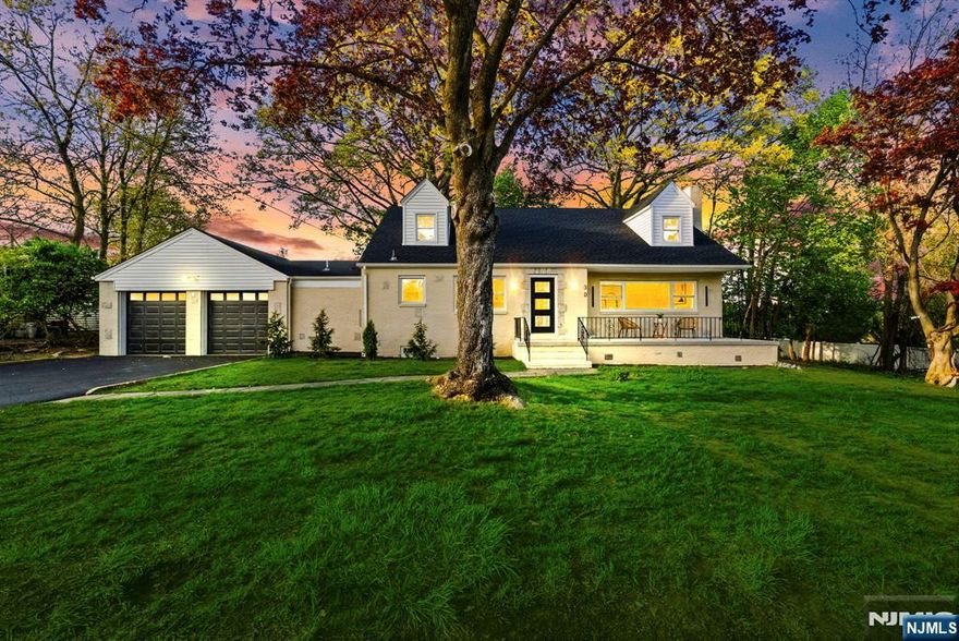Welcome to this fully gut-renovated 5-bedroom, 4.5-bath residence in one of Emerson's most desirable neighborhoods. Every system and finish is brand new, delivering the space, design, and turnkey lifestyle today's luxury buyers are seeking. The sun-filled main level features an open-concept layout anchored by a designer chef's kitchen with an 8-foot waterfall island, premium stainless appliances, custom cabinetry, and sleek modern finishes. Wide-plank hardwood floors run throughout. Three spacious bedrooms, a full bath, a powder room, and a breezeway with direct garage access complete the main floor. Upstairs, two private en-suites offer true retreat living. The primary features a walk-in closet and spa-inspired bath with custom tile and designer fixtures. The second en-suite is equally appointed, ideal for guests or a home office. The fully finished basement adds a full bath, laundry, and flexible space, perfect for a media room, gym, or home office. Completely rebuilt with all new HVAC, electrical, plumbing, and roof, this home delivers peace of mind and long-term value. Additional highlights include modern, elegant fixtures throughout and a living room chimney (decorative). Set on a generous lot with a welcoming front porch and spacious backyard, this move-in-ready home delivers luxury, quality, and sophistication in a prime Emerson location.