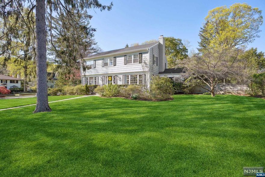 Well built, well maintained & well-loved for over 40 years. This mint-condition Colonial is ready for you to move right in. Spacious floor plan with bonus sunroom & family room on the first floor. Four bedrooms & two baths on the 2nd floor plus 5th bedroom with bath, a few steps off the kitchen. Set on an oversized lush landscaped private corner property. Finished lower level with an expansive gym. Located in the tranquil, peaceful Estate Section of Montclair. NJ Transit bus is just a block away. Minutes to downtown and all it has to offer, not to be missed!