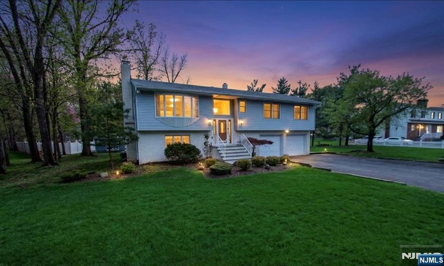 Offered for the first time, this meticulously maintained 3-bedroom, 2.5-bath bi-level home sits on over a serene half-acre lot, delivering the perfect blend of space, comfort, and opportunity. Pride of ownership is evident throughout, with generously sized bedrooms, including a primary bedroom with walk in closet and a well-designed layout ideal for both everyday living and entertaining.The main level features bright, inviting living spaces with access to a spacious covered deck overlooking the peaceful backyard perfect for morning coffee or evening relaxation. The lower level offers a versatile layout complete with a summer kitchen, opening to a beautifully finished paver patio, making it ideal for extended living or entertaining guests.With a possible mother-daughter setup and subdivision potential, this property presents exceptional flexibility for a variety of lifestyles or future investment opportunities.Enjoy the convenience of being within walking distance to the scenic trails and natural beauty of Rifle Camp Park and Garret Mountain Reservation, offering year-round outdoor recreation just moments from your doorstep.A rare opportunity to own a lovingly cared-for home in a tranquil setting with endless potential.