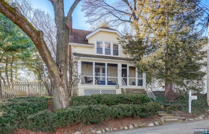 Delightful Dutch Colonial brimming with curb appeal in a convenient location. Well-maintained with 3 bedrooms, 2 full bathrooms, hardwood floors throughout and newly resurfaced on the 1st level, freshly painted rooms, stylish new fixtures, and easy access to restaurants, Starbucks, shops, and the bus to NYC. A sizable covered front porch perfect for entertaining or quiet relaxation welcomes you to the 1st level, beaming with natural light and loads of charm. A living room featuring a wood-burning fireplace, a sizable formal dining room, an eat-in kitchen with a reverse osmosis water system, and a full bathroom complete the first level. All bedrooms are on the 2nd level, sharing a full bathroom. A part-finished basement ideal as a play space, a 2-car detached garage, and a large Trex deck overlooking a nice-sized fenced backyard complete the home. Don't miss out on this fabulous Midland Park gem!