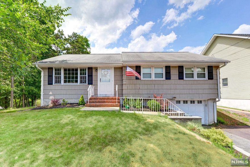 Pleasantly appointed ranch on quiet street with beautiful hardwood floors, open floor plan, and generous bedrooms. Downstairs features a one car attached garage with walk in access to the finished basement, including Rec Room, Full Bath, Laundry, and Utilities. Enjoy the rear deck with mountain views, overlooking the large backyard, with newer septic system, lawn sprinklers, and central air conditioning. Newer electric service with generator hook up.