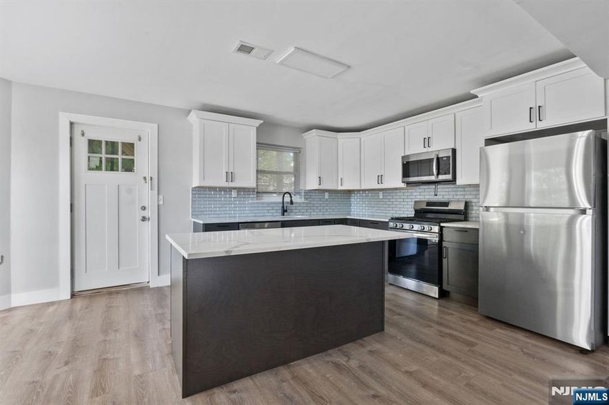 Welcome to your next home in the vibrant and rapidly growing East Orange community! This beautifully updated 3-bedroom, 2-bath apartment offers the perfect blend of space, style, and convenience, located right on sought-after Park Avenue. Step inside to discover a bright, open-concept living space featuring sleek hardwood floors, large windows that flood the rooms with natural light, and a fresh, modern design throughout. The fully renovated kitchen boasts stainless steel appliances, quartz countertops, custom cabinetry, and a stylish tile backsplash â€“ perfect for home cooks and entertainers alike. Each of the three bedrooms is generously sized with ample closet space, while the two full bathrooms are outfitted with contemporary fixtures, modern vanities, and clean, tiled finishes.