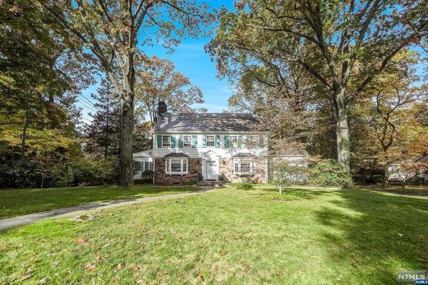 Bahr Rapaport 917-848-1784 and The Rapaport Group presents... This classic center hall colonial is located on one of the most sought-after streets in Tenafly's prestigious Old Smith Village. Its elegance is obvious from the moment you walk in; the rooms are spacious and filled with natural light. first floor consists of a large living room with wood burning fireplace; a family room with a wood coffered ceiling; a large formal dining room; granite clad powder room; large eat-in kitchen; and bedroom with one full bathroom. The second floor houses two bedrooms, full bathroom and a primary bedroom suite. The attic off of the master bedroom could be built out to create an additional bedroom. The basement has full ceiling height with three large rooms, one can be converted to a bedroom with direct access to the backyard. The grounds are beautiful. The mature trees that surround the property provide complete privacy. Home features beautiful slate roof, Full house generator and more...