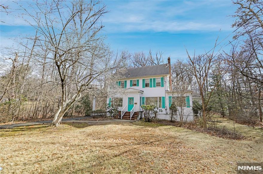 This spacious Center Hall Colonial offers plenty of room and a convenient location. Hardwood floors and a grand foyer lead to a comfortable living space with a family room, sunroom, library/optional bedroom, formal dining room, and eat-in kitchen with ample cabinetry.Upstairs, five bedrooms and two full baths provide flexibility for a growing household. The backyard offers a private outdoor space to enjoy. Located close to downtown Englewood, this home provides easy access to NYC and local amenities. A great opportunity in a prime location!