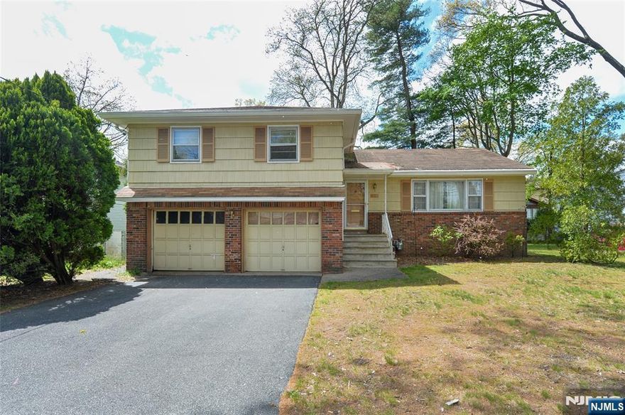 Open House Sunday, May 3, 12-4pm. Estate sale being sold as-is with no known structural issues, offering a great opportunity to update and add value in the highly desirable Milnes section of Fair Lawn. This spacious split-level home features an entry foyer with a closet, a bright living room with vaulted ceilings and a bay window, a formal dining area, and a large eat-in kitchen. The upper level offers three generously sized bedrooms, including a primary suite with a private bath, plus a full hall bath. The lower level includes a family room, half bath, and direct access to the yard and attached two-car garage. The unfinished basement provides incredible potential for additional space for recreation, storage, and laundry. This home has over 1,800 sq ft, a well-designed layout, and strong bones, ready for your personalized updates. Pleasantly located near top-rated public schools, NYC transportation, shopping, parks, and houses of worship.