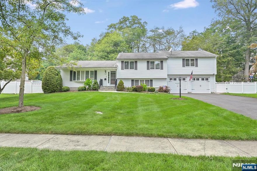 Welcome to your dream home in the heart of Waldwick! This expanded 5-bedroom, 2.5-bath Split-Level stunner is the perfect blend of space, style, and comfort. From the moment you enter the foyer, you'll be captivated by the oversized living and dining rooms, bathed in natural light, and seamlessly connected to the deck through sliding glass doorsâ€”perfect for indoor-outdoor entertaining. The sun-drenched kitchen is a showstopper, with Corian countertops, featuring wraparound cabinetry, skylights, and a center island with seatingâ€”ideal for gathering and everyday living. Upstairs on the 3rd floor, retreat to the luxurious king-sized primary suite complete with a walk-in closet, spacious full bath/double sinks, stall shower, skylights, and balcony. Three additional spacious bedrooms and a full hallway bath complete the 2nd level. Downstairs, unwind in the expansive family room, gas fireplace and sliders leading to the beautifully landscaped backyard. This level also offers a powder rm (previously full bath & can be converted back), the 5th bedroom, laundry, utility room, and access to an oversized two-car garage with an abundance of storage. Step outside to your private backyard oasisâ€”complete with a meticulously maintained in-ground pool and lush landscaping, perfect for summer fun and unforgettable gatherings. This home is truly move-in ready and made for making memories.