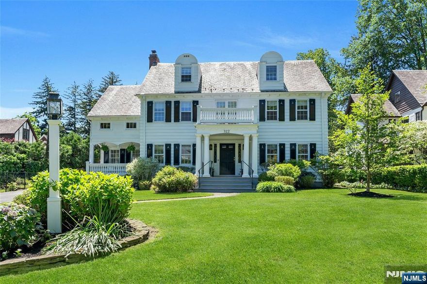 Perfectly situated on a picturesque street in the heart of Glen Ridge just moments from top-rated schools & NYC train, this elegant, meticulously updated 6 BR/5.1 BA Colonial blends timeless architecture with high-end modern updates, wrapped in warmth & thoughtful design. At its heart is a reimagined kitchen & family room featuring custom Parsons Cabinetry, quartz & leathered marble countertops, center island, high end appliances including 48in Blue Star 6 burner/griddle dual oven & Sub-Zero refrigerator, butler's pantry with wine & beverage refrigerators & custom built-ins. This space flows into a spacious backyard with a bluestone patio perfect for al fresco dining, relaxing by the fire pit & hours of play. A beautifully curated second-floor expansion adds a fourth bedroom with en-suite bath, a sunlit landing with window seat & a stunning primary suite custom walk-in closet/dressing room with bonus washer/dryer hookup. A fully renovated hallway bath offers a tub, shower and custom cabinetry. The third floor includes two more bedrooms & full bath ideal for guests, office or playroom. A recently finished lower level offers high ceilings, full bath & flexible space with wet bar. Highlights include a two-car attached garage with entrance to custom mudroom, Sonos sound system, central air & rebuilt front balcony. 322 Washington Street offers the very best of Glen Ridge...classic charm, modern comfort & an unbeatable location in one of the town's most beloved neighborhoods.
