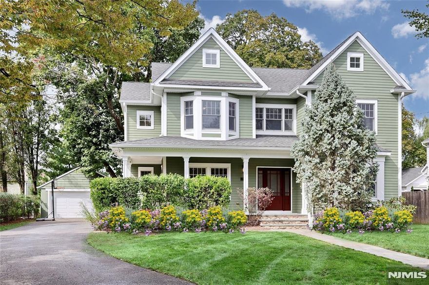 Stunning Custom Colonial in the Heart of "The Village" This beautifully maintained, custom-built gem showcases timeless architecture. High ceilings, elegant moldings, and oversized windows that flood the home w natural light. The open floor plan creates a seamless flow, perfect for both everyday living & elegant entertaining. The inviting Great Room w cozy fireplace walls of windows connects to the gourmet kitchen, featuring top of line SS appliances granite countertops, large island, & sliding doors to a private patio & outdoor fireplace. Butlers Pantry w cooler, opens to the formal dining room with seating for twelve, while a first-floor home office (or traditional living room), convenient mudroom, and powder room complete the main level. Upstairs, the luxurious primary suite offers a spa-like bath/oversized Koehler jetted tub & separate xlarge shower . 3 additional spacious bedrms share a full bath w double sinks, and a nearby laundry chute adds convenience. The finished lower level expands the living space with a theatre/media rm, multi purpose bonus rm, exercise rm, full bath, & generous storage. Outside, mature landscaping surrounds the property, creating privacy for the backyard retreat w patio & outdoor fireplace. An oversized two-car garage completes this exceptional home. Located close to all 3 schools, NYC transit, town, pool, & parks, this home combines custom quality w modern upgrades. Truly move-in ready. Seller has NJ Referral License