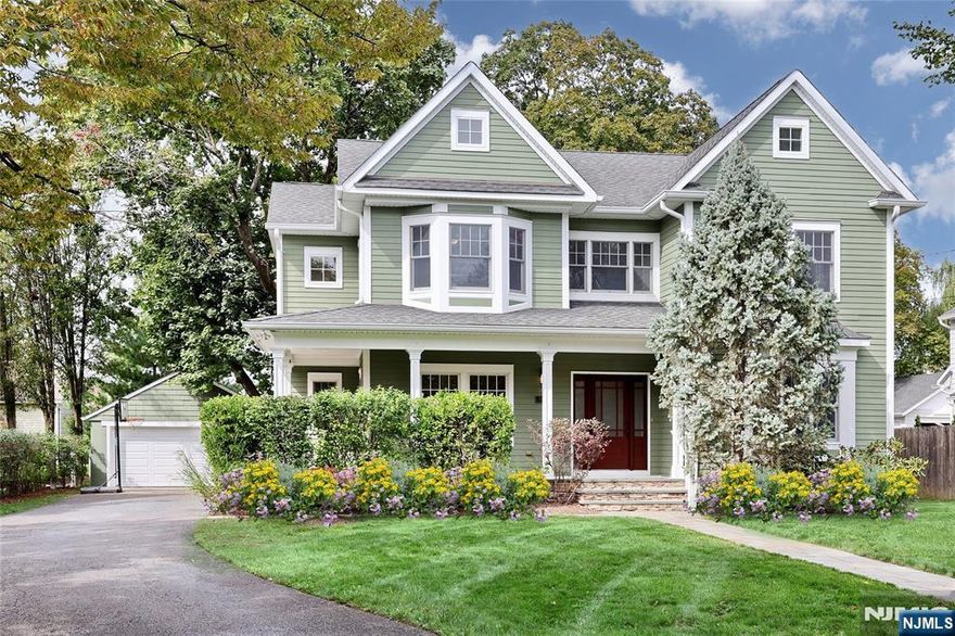 Stunning Custom Colonial in the Heart of "The Village" This beautifully maintained, custom-built gem showcases timeless architecture. High ceilings, elegant moldings, and oversized windows that flood the home w natural light. The open floor plan creates a seamless flow, perfect for both everyday living & elegant entertaining. The inviting Great Room w cozy fireplace walls of windows connects to the gourmet kitchen, featuring top of line SS appliances granite countertops, large island, & sliding doors to a private patio & outdoor fireplace. Butlers Pantry w cooler, opens to the formal dining room with seating for twelve, while a first-floor home office (or traditional living room), convenient mudroom, and powder room complete the main level. Upstairs, the luxurious primary suite offers a spa-like bath/oversized Koehler jetted tub & separate xlarge shower . 3 additional spacious bedrms share a full bath w double sinks, and a nearby laundry chute adds convenience. The finished lower level expands the living space with a theatre/media rm, multi purpose bonus rm, exercise rm, full bath, & generous storage. Outside, mature landscaping surrounds the property, creating privacy for the backyard retreat w patio & outdoor fireplace. An oversized two-car garage completes this exceptional home. Located close to all 3 schools, NYC transit, town, pool, & parks, this home combines custom quality w modern upgrades. Truly move-in ready. Seller has NJ Referral License