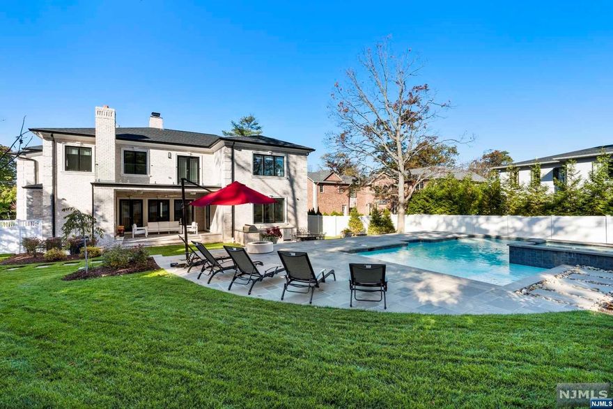 CUSTOM BUILT LUXURY HOME IN PREMIER NORTH CLIFFS! BRICK & PRECAST EXTERIOR, UNIQUELY DESIGNED IRON DOORS LEAD TO THE GRAND FOYER W/SOARING COFFERED CEILINGS, ITALIAN PORCELAIN RADIANT-HEATED TILES, LIVING & DINING W/IMPRESSIVE MILLWORK. OPEN FLOOR PLAN W/TOP NOTCH AMENITIES-ELEVATOR, SAUNA, SURROUND SOUND & SECURITY. AT THE HEART OF THE HOME IS A DESIGNER KITCHEN W/BUTLERS PANTRY, WOLF/SUBZERO/MIELE APPL, OVERSIZED QUARTZ ISLAND. FAMILY ROOM W/GAS FIREPLACE HAS WALL OF FRENCH DOORS OPENING TO THE COVERED PATIO OVERLOOKING LUSH GROUNDS, HEATED GUNITE POOL, JACUZZI & OUTDOOR KIT. UPPER LEVEL FEATURES FABULOUS PRIMARY SUITE W/SITTING RM, FIREPLACE, GLASS BALCONY, SPA BATH W/SOAKING TUB & STEAM SHOWER, DREAMY WIC W/CUSTOM SHELVES & CENTER ISLAND. THREE ENSUITES, LAUNDRY & BACK STAIRCASE COMPLETE THIS LEVEL. LOWER LEVEL HAS FULLY EQUIPPED THEATER, GYM, REC ROOM, ENSUITE & MUDRM TO 3-CAR HEATED GARAGE. PRIVATE OASIS 0.60 ACRES RARELY FOUND IN ENGLEWOOD CLIFFS, LOW TAXES, MINUTES TO NYC!