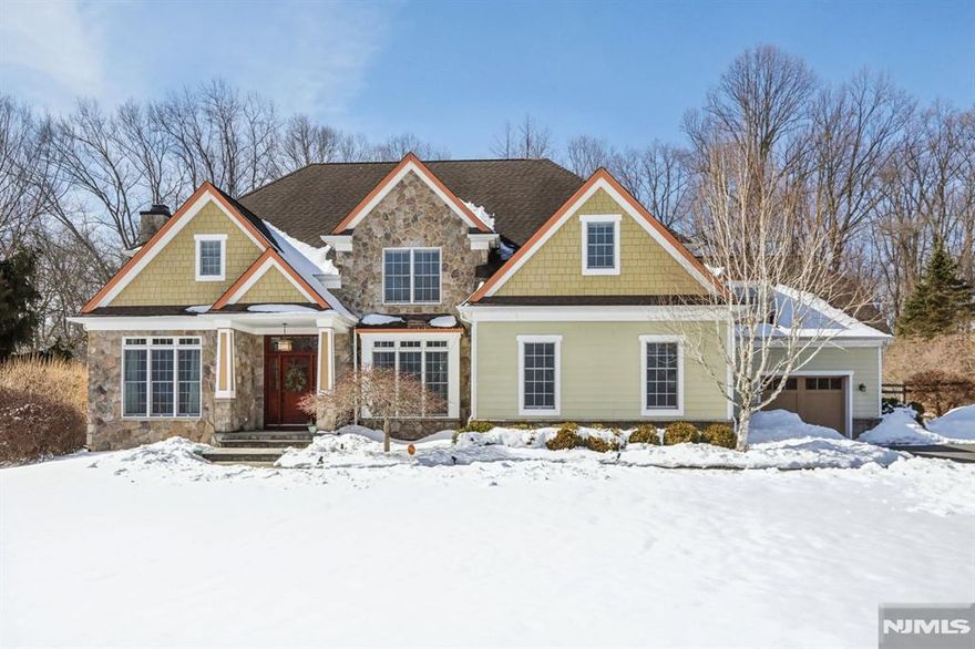 Welcome to this exceptional estate set on a private 2.47-acre, cul-de-sac road, in highly sought-after Chester. Offering approximately 4,900 square feet across the first and second floors, this elegant residence combines timeless design with modern comfort and exceptional entertaining spaces.The main level showcases a beautifully appointed kitchen with two walk-in pantries, formal dining and living rooms, an inviting family room, powder room, full bath, and a spectacular sunroom with a soaring cathedral ceiling and walls of natural light, opening to a newly installed deck overlooking the serene property.The second floor features a luxurious primary suite with spa-like bath, soaking tub, heated floor, and expansive walk-in closet. Three additional spacious bedrooms, two full bathrooms, and a convenient laundry room provide ideal everyday functionality.The finished lower level over 1,000 square feet, offering a media room, recreation and game areas, exercise room, and an impressive 400-bottle wine cellar perfect for entertaining.A three-car garage with a bonus flex space above is ideal for a home office, studio, or guest retreat. Integrated Bose speakers throughout and irrigation system complete this exceptional offering, blending privacy, luxury, and convenience just moments from Chester's charming downtown.