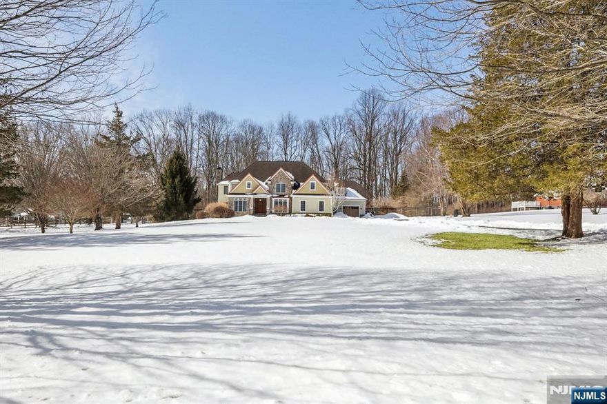 Welcome to this exceptional estate set on a private 2.47-acre, cul-de-sac road, in highly sought-after Chester. Offering approximately 4,900 square feet across the first and second floors, this elegant residence combines timeless design with modern comfort and exceptional entertaining spaces.The main level showcases a beautifully appointed kitchen with two walk-in pantries, formal dining and living rooms, an inviting family room, powder room, full bath, and a spectacular sunroom with a soaring cathedral ceiling and walls of natural light, opening to a newly installed deck overlooking the serene property.The second floor features a luxurious primary suite with spa-like bath, soaking tub, heated floor, and expansive walk-in closet. Three additional spacious bedrooms, two full bathrooms, and a convenient laundry room provide ideal everyday functionality.The finished lower level over 1,000 square feet, offering a media room, recreation and game areas, exercise room, and an impressive 400-bottle wine cellar perfect for entertaining.A three-car garage with a bonus flex space above is ideal for a home office, studio, or guest retreat. Integrated Bose speakers throughout and irrigation system complete this exceptional offering, blending privacy, luxury, and convenience just moments from Chester's charming downtown.