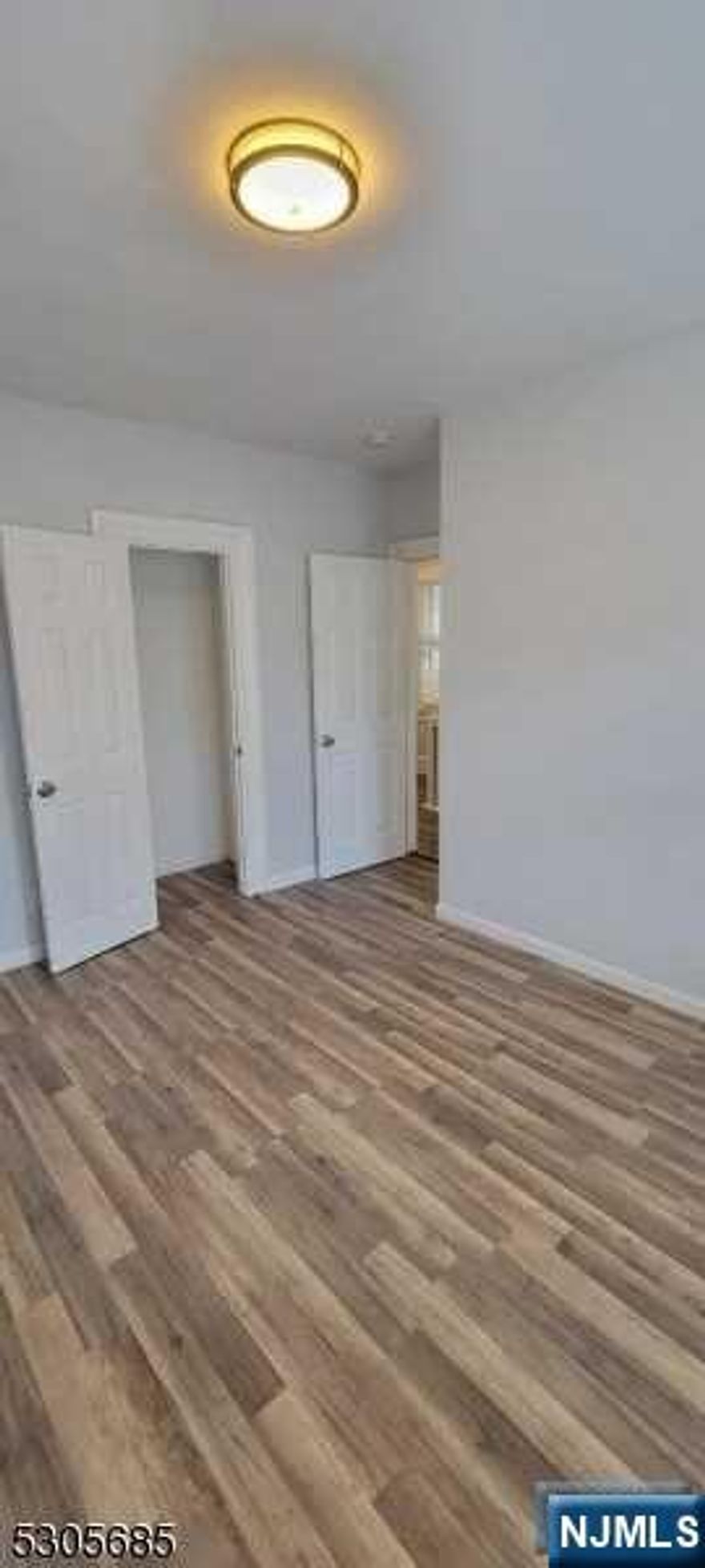 This delightful Colonial, originally renovated late 2018, (recently refinished & repainted) greets you with a welcoming foyer (mudroom). As you step inside, the hardwood floors flow seamlessly from the living room through the dining area. The sunroom off the living room also offers the possibility of an additional bedroom. The kitchen is a highlight, featuring stainless steel appliances (just needs a refrigerator), a sleek granite countertop, and elegant grey shaker cabinets. The kitchen is open to the dining and living rooms with a convenient powder room near. Off the living room, beyond the decorative fireplace is a separate sun room, that could be imagined for multiple uses...an office, TV room, study or guest bedroom. Upstairs, the second floor boasts laminate flooring and hosts three bedrooms- here is where the main bathroom is located. The full basement provides ample space for storage for all your needs or your imagination for playroom.