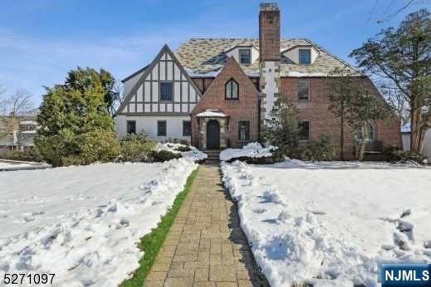 Your new home awaits on one of Glen Ridge's best blocks in town! Enter this lovely, historic Tudor-style home built after 1900 and just renovated that exudes warmth and style. A fabulous house for entertaining with an open floor plan and high ceilings creates a harmonious flow throughout this beautifully-designed house. The first floor features a first floor bedroom with en-suite bathroom, open concept living room, a formal dining room, a den, and a new custom kitchen installed with stainless steel high-end appliances, a quartz eat-in kitchen island, and pantry. Boasting endless upgrades and original details, this stately home has 7 impressively large bedrooms, 5 full baths, 2 half baths, 3 car attached garage, and a finished basement set upon a beautifully landscaped half acre of land with underground sprinkler system and a short walk to NYC trains, top rated schools, award-winning restaurants all await and welcome you to the charming town of Glen Ridge.