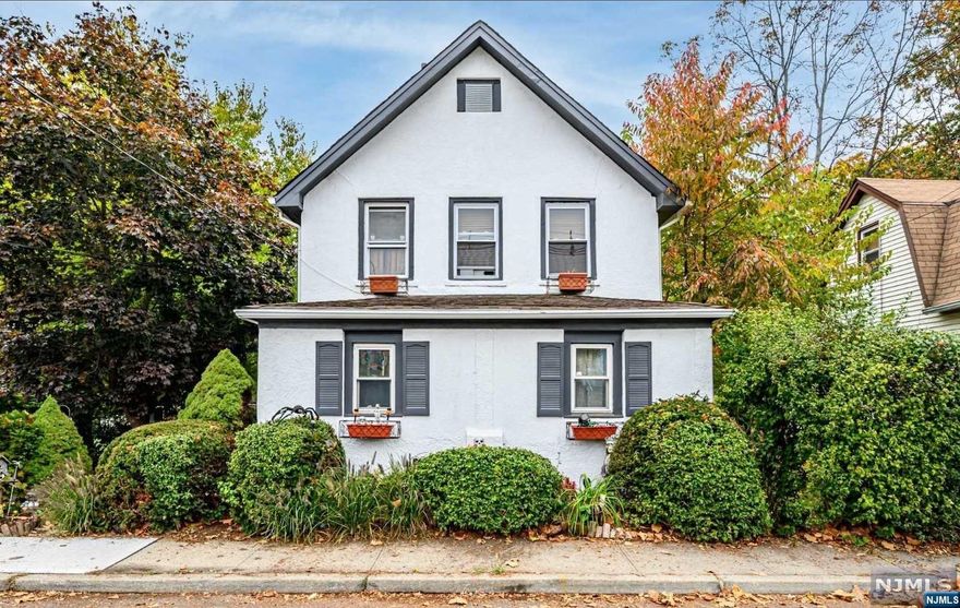 Seize the chance to own a premier multifamily residence in the coveted Glenwood Park neighborhood. Property features 2 well-kept units, ideal for generating rental income or multigenerational living. Each unit has private entrance, 2 bedrooms, 1 full bath, & inviting eat-in kitchen. The generous living areas are bathed in natural light, with modern updates throughout. The first-floor unit includes a jetted tub, a sunroom, and a versatile office space or walk-in closet. The second unit is completely renovated, showcasing stone countertops, marble-style tiles, & contemporary backsplash. Separate gas, electric, & heating systems ensure autonomy for each unit. The full basement, accessible through private entrances, offers laundry & storage. The private backyard features a paver patio and outdoor fireplace. A detached 2-car garage & ample parking. Close to Starbucks, schools, parks, & easy access to NYC. Can be delivered vacant! Contact Listing Agent for showing!