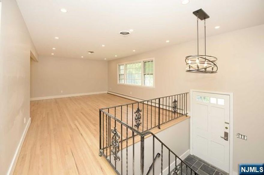 Welcome to your dream rental home in the heart of Fair Lawn, a town celebrated for its top-rated schools, vibrant parks, thriving shopping and dining scene, and exceptional commuter access to NYC. This pristine 4-bedroom, 3-bathroom residence has been thoughtfully renovated throughout, seamlessly blending modern style with everyday comfort. All bathrooms have been beautifully updated, offering a fresh, spa-inspired feel. An elegant entry foyer with a striking chandelier sets the tone upon arrival. The main level features a newly designed kitchen with stainless steel appliances, ideal for both casual meals and entertaining. A sun-filled living room, spacious dining area, three generously sized bedrooms, and two full updated bathrooms complete this level with effortless flow and functionality. The ground level provides a private fourth bedroom, an additional fully renovated bathroom, and a large family room perfect for relaxing, entertaining, or flexible living. Direct access to the two-car garage adds convenience and ample storage. Perfectly positioned near parks, recreation facilities, houses of worship, major highways, and public transportation, this home offers the best of suburban living with unmatched accessibility. A rare opportunity to enjoy comfort, style, and all that Fair Lawn has to offer, this exceptional home is not to be missed.