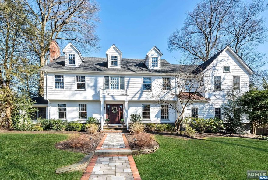 Timeless architecture meets modern comfort in this stately center hall colonial on a coveted street in the popular Cheelcroft neighborhood. The extensive 2015 renovation was thoughtfully designed, from the home's extraordinary curb appeal to its highly functional floor plan where natural light fills every corner. Relax in the sunlit living room and den, each with a fireplace. Entertain in the stylish kitchen with custom cabinets, chestnut-topped island, and top-of-the-line appliances. Unwind in the stunning 750sf primary suite with vaulted ceiling, oversize dressing room, spa-like bath, and adjacent office or nursery. Four additional bedrooms and two full baths on the second floor offer space for family and guests. Other special features include a large mud room, first floor laundry room, large lower-level recreation space, oversize 2C garage, and private brick patio. Minutes to downtown shops, restaurants, and train station. A perfect place to call home!