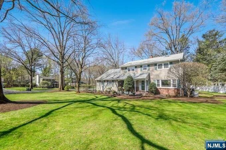 Charming & spacious Colonial-style home located in highly desirable Harrington Park. Beautiful property boasts a well-manicured lawn & front porch that immediately captivates you. As you step inside, you'll be struck by the warm & inviting atmosphere that permeates throughout the home. The main level features a large living room, an elegant dining room; ideal for hosting dinner parties. The updated kitchen is light & bright, with Corian countertops, ample cabinet & workspace...enjoy breakfast or a quick bite in the nook area. The family room w/ fireplace is conveniently off the kitchen for an open floor plan. Upstairs, you'll find four generous bedrooms, including a primary suite w/ walk-in closet. The other bedrooms share a full bath, ensuring convenience for everyone. Outside, the backyard finds a large composite deck, which can host barbecues & outdoor get-togethers. Other features include a whole house generator, sprinkler system, 2 car att. garage, Central AC & much more!!