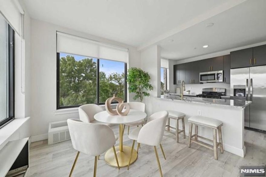 *Limited time incentives - One month free on selected units* Welcome to The Modern, a luxury high-rise apartment building in East Orange, NJ. This beautiful 2-bedroom, 2-bath home features a spacious kitchen with ample cabinetry, sleek stainless steel appliances, and elegant granite countertops. The primary bedroom offers comfort and tranquility with an ensuite bathroom, while the second bedroom provides generous space and two large closets. Sunlight pours through large windows, highlighting the modern design and creating a serene urban retreat. With in-unit laundry and thoughtfully designed interiors, this apartment elevates city living, combining style and convenience in the heart of East Orange's vibrant community. PARKING AVAILABLE AT ADDITIONAL COST - PHOTOS ARE OF SIMILAR UNIT