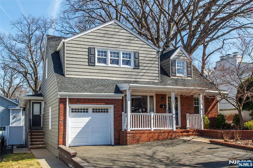 GET READY TO MAKE THIS MOVE!! There will be nothing to do but bring your furniture and settle into this lovely, spacious home. This single family home has the added benefit of a second floor suite for an extended family situation or even work from home. Enter to an open living, dining & kitchen with rich hardwood floors and recessed lighting. The kitchen has been fitted with new stainless steel appliances within the last 4 years and has beautiful mahogany cabinets and granite counter tops. The first floor also features three good size bedrooms with his 'n hers closets in the Master AND two full baths. The second floor has a spacious living area, bedroom, kitchen with an great island and dining are AND the third full bathroom. The charm of the front porch, the privacy of a fenced in yard with a large deck, finished basement & garage with room in the driveway for 2 cars are not to be missed!