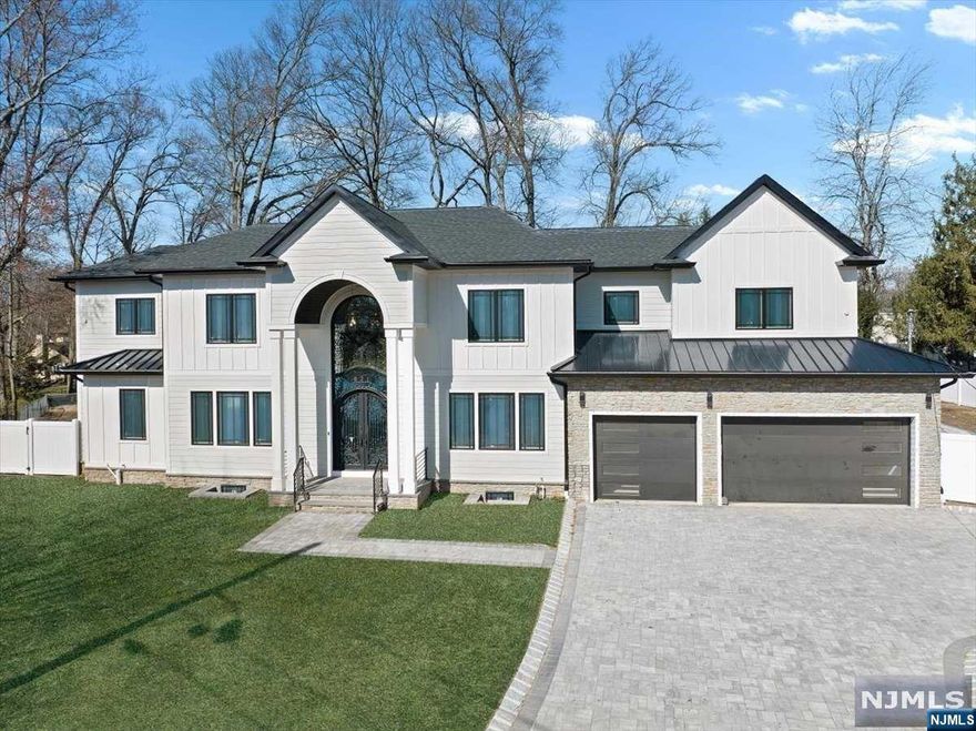 NEW CONSTRUCTION,This 7500 sq ft 6 bed/5.1 bathroom Colonial offers a blend of timeless elegance and modern luxury. Located just minutes from NYC,top rated schools, downtown Ridgewood, Paramus mall and Garden State Plaza. Close to 0.5 acre flat lot offers a large driveway, 3 car garage, outdoor living space and a swimming pool. The open concept floor plan boasts 9' ceilings on the first floor and 9' on the second floor. The first floor features a double height foyer, chef's kitchen with Thermador appliances that opens to the family room, guest suite, dedicated office/study, and a butler's pantry. On the second floor, the nearly 950 sf primary suite offers a vaulted ceiling, two huge dressing rooms, and spa like marble bathroom. The second floor also includes 3 bedrooms all with walk in closets, 2 bathrooms and a laundry room. The lower level has a large Guest suit, rec room with a bar and a room that can be converted to a wine cellar as well as space for a gym or media room.