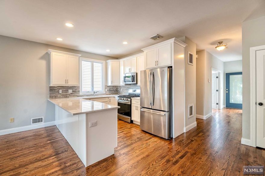 Newly renovated half-duplex located in Garfield, NJ now for sale! Featuring a open layout and modern feel throughout the house. the 1st floor offers an office room, bathroom, dining room/living room combo and a new kitchen with brand new stainless steel appliances and marble countertops. The second floor features 3 bedrooms, 2 bathroom and a laundry area. Master bedroom includes en-suite and a walk-in closet. The second floor also has access to the attic that includes storage. The ground floor allows access to the garage and a finished room with a full bathroom. Town offers free pre-school, train station and easy access to major highways. Don't wait, set-up your appointment today!