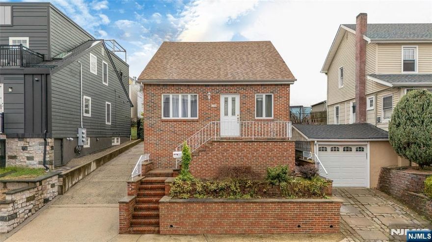 Step into a beautifully expanded and thoughtfully updated home that blends classic style with modern comfort across three generous levels. Nestled on a tranquil street in Kearny, this 3-bedroom, 2 1/2 bath residence offers meticulously finished living space, with an effortless layout ideal for entertaining and everyday living. The main living floor impresses with a bright and spacious living room, a formal dining area and a stylish eat-in kitchen, which is complete with ample counter space and room for gatherings. Two bedrooms and a full bath complete this level, creating a perfect blend of functionality and flow. Upstairs, discover a sprawling primary suite sanctuary complete with a full bath, oversized walk-in closet and additional attic space for storage or a cozy retreat. The fully finished lower level is your entertainment haven. Host guests at the built-in wet bar, enjoy movie nights in the recreation room and take advantage of a large laundry space and a convenient half bath.